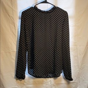 Black and white polka dot ruffle neck blouse